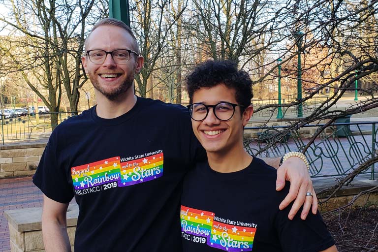 Two students pose for photo.